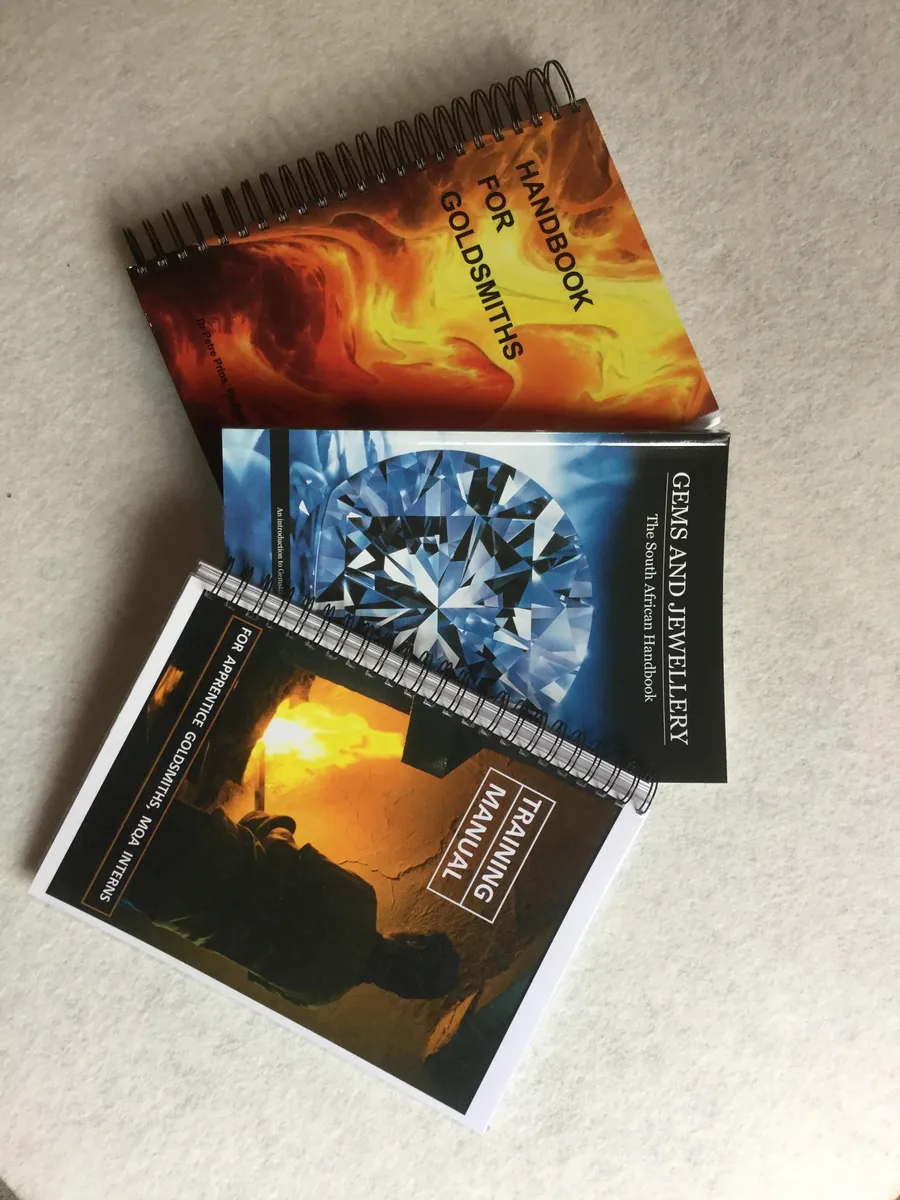 Three handbooks by Dr Petré Prins: Handbook for Goldsmiths, Gems and Jewellery: The South African Handbook, and a training manual for apprentice goldsmiths