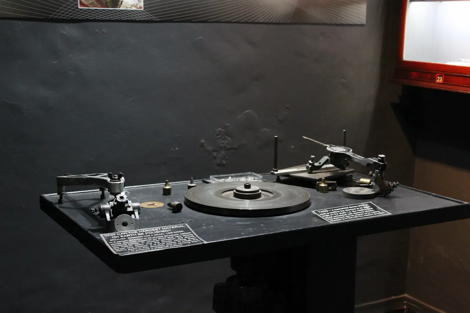A diamond cutter’s polishing bench in the Museum of Gems & Jewellery, with the scaife, its flat polishing wheel, at the centre and a tang for holding the stone beside it